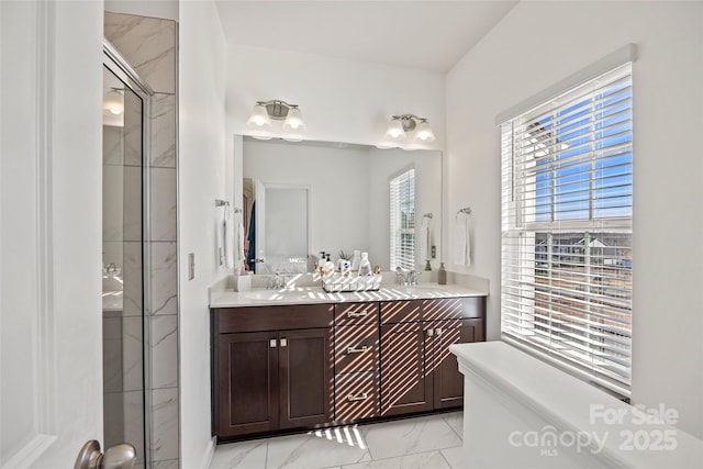 bathroom with vanity and a shower with shower door