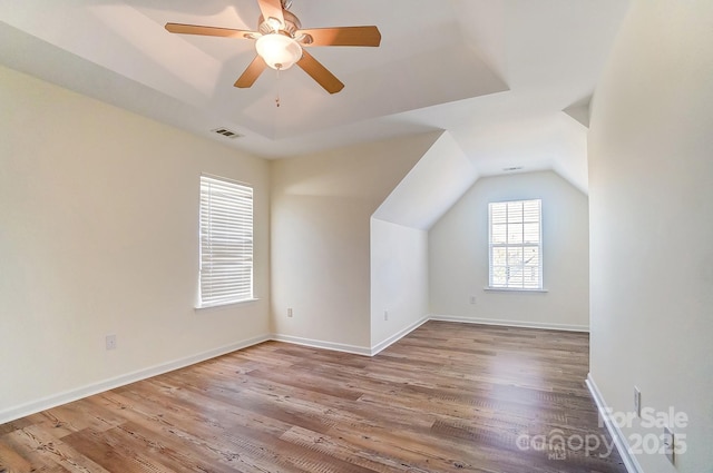 bonus room featuring ceiling fan, light hardwood / wood-style flooring, and lofted ceiling