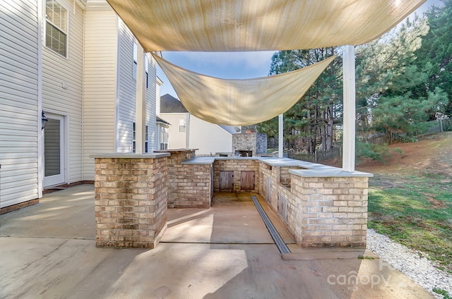 view of patio featuring an outdoor kitchen