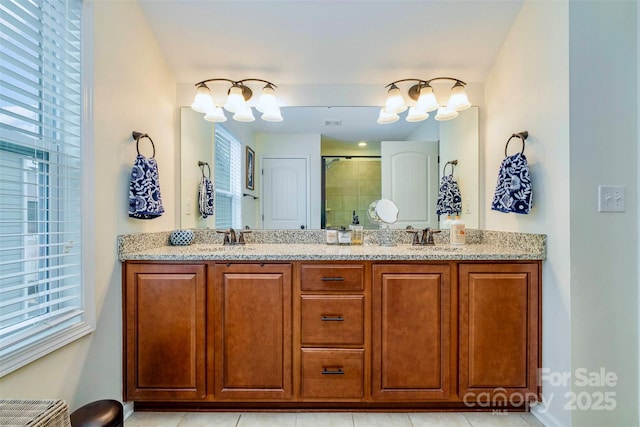 bathroom featuring vanity, plenty of natural light, and walk in shower