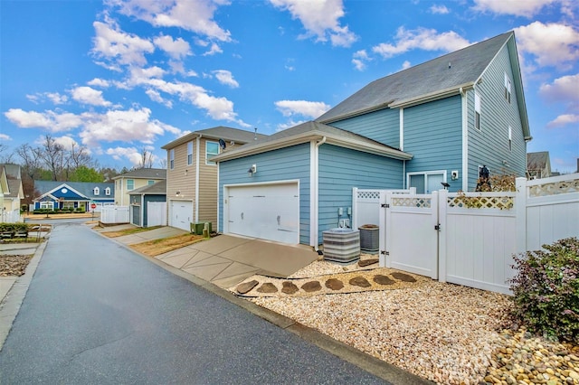 view of side of home featuring central AC unit