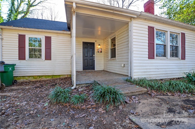 property entrance featuring a patio area