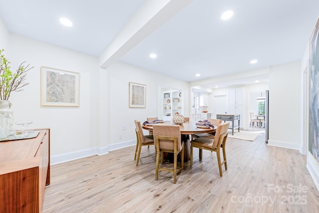 dining room with light hardwood / wood-style flooring