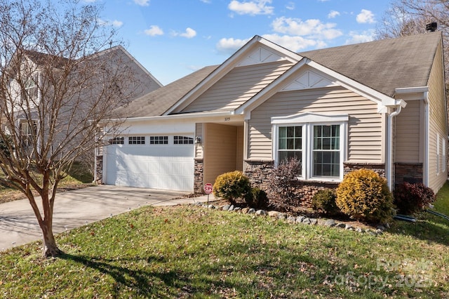 view of front of house featuring a garage and a front lawn