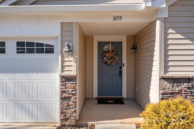 entrance to property featuring a garage