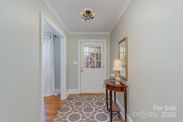 doorway featuring hardwood / wood-style floors and crown molding