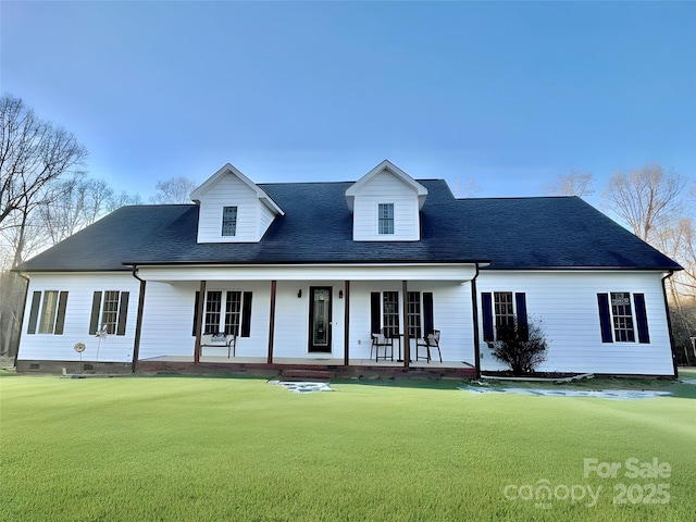 view of front facade with crawl space, covered porch, a front lawn, and roof with shingles