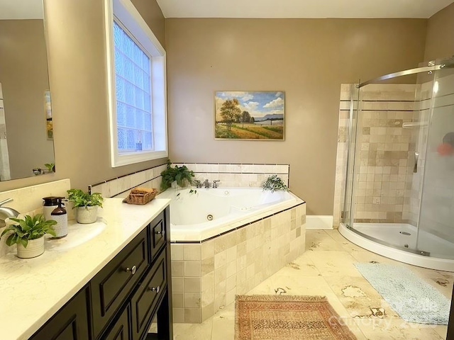 full bath featuring a jetted tub, a shower stall, and vanity