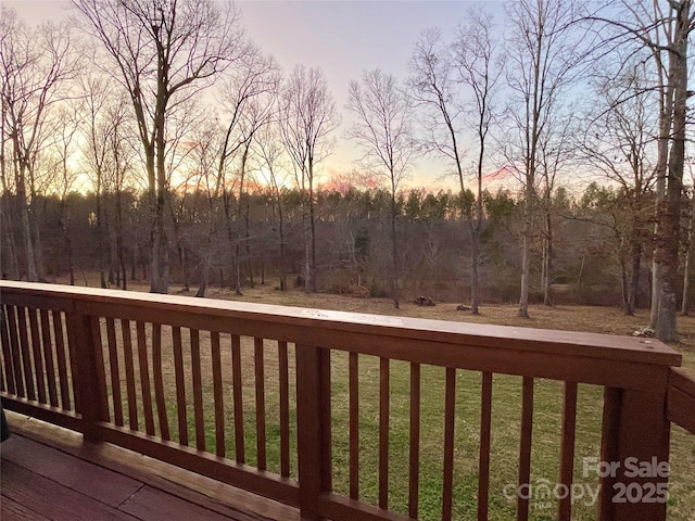 deck at dusk with a yard