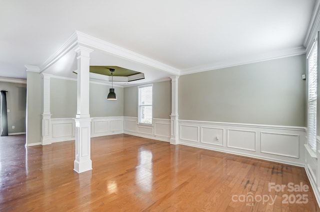 unfurnished room featuring wood-type flooring and crown molding