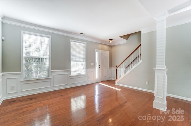 entrance foyer featuring a wealth of natural light and wood-type flooring