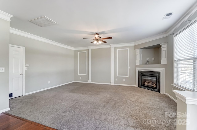 unfurnished living room featuring carpet floors, ceiling fan, and ornamental molding