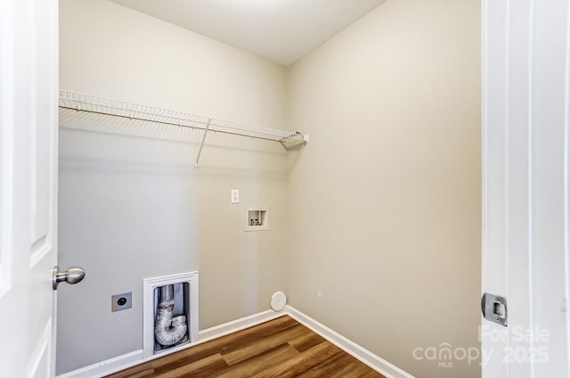 washroom featuring hookup for a washing machine, electric dryer hookup, and wood-type flooring