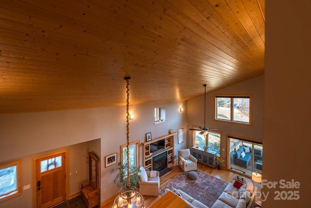 living room featuring high vaulted ceiling, hardwood / wood-style floors, ceiling fan, and wooden ceiling