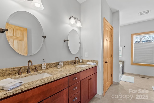 bathroom featuring vanity and tile patterned flooring