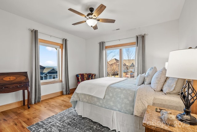 bedroom featuring wood-type flooring and ceiling fan