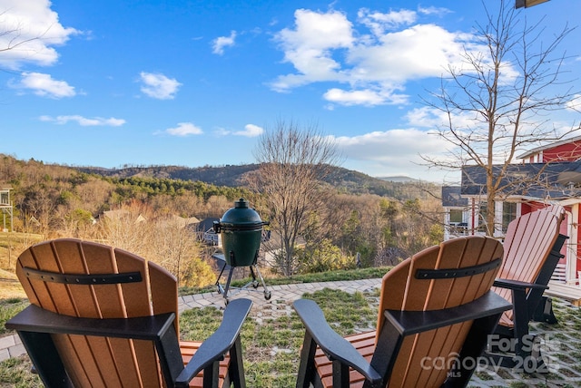 view of yard with a mountain view and a patio area