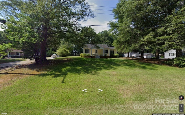 view of front of home with a front lawn