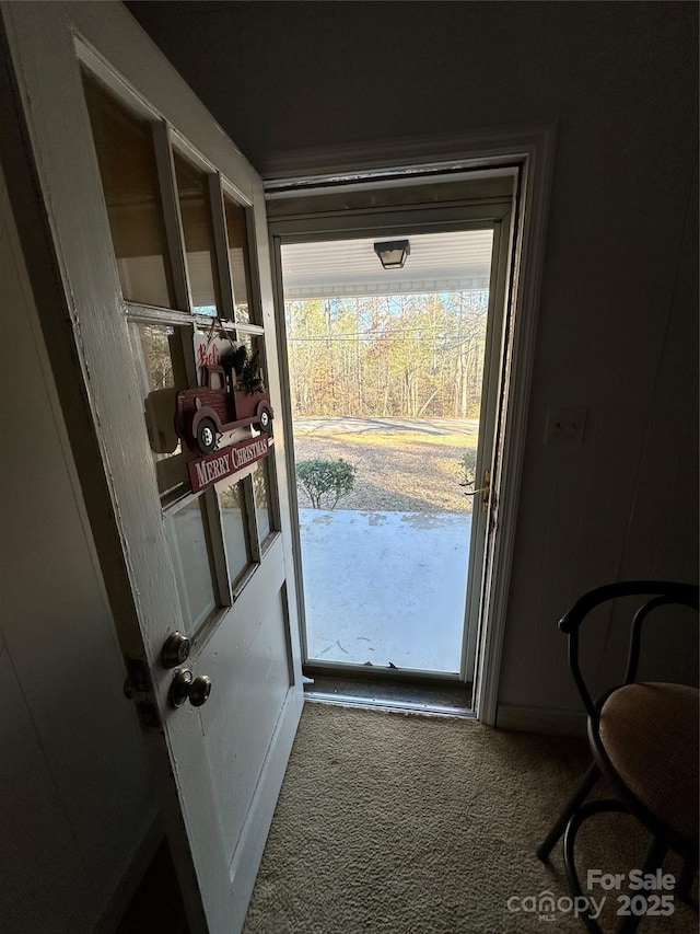 doorway with carpet floors