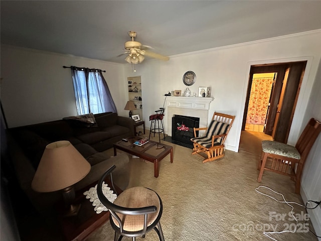 living room featuring plenty of natural light, ceiling fan, and ornamental molding