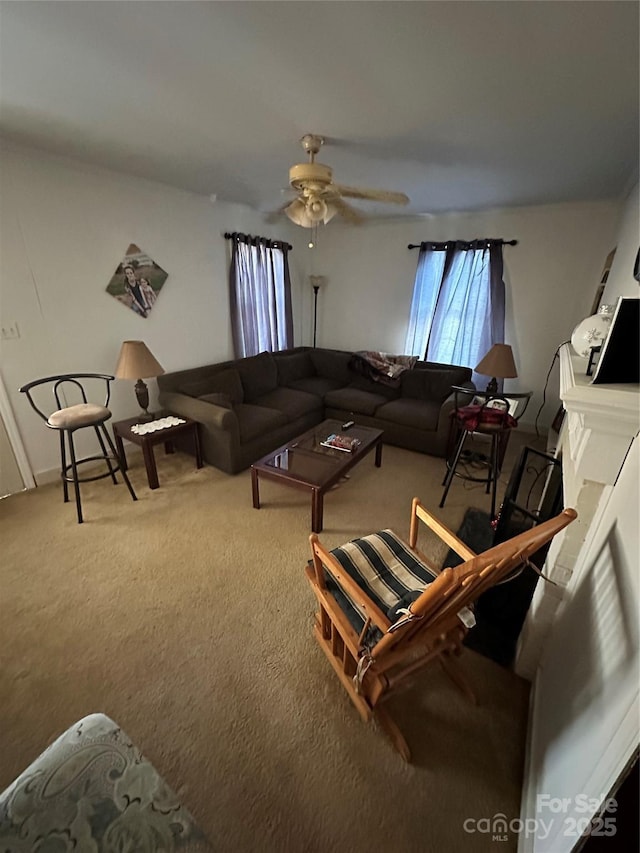 living room featuring ceiling fan and carpet floors