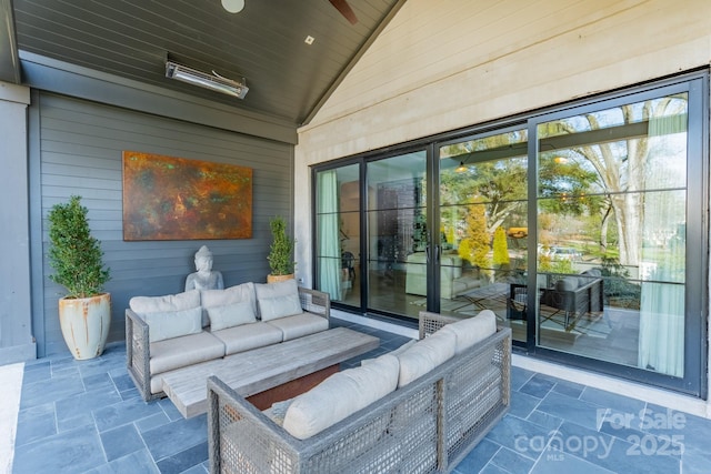 view of patio / terrace featuring an outdoor living space and ceiling fan