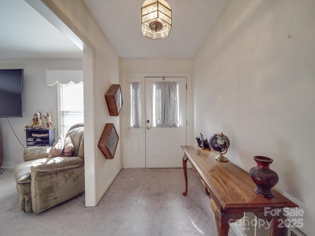 view of carpeted foyer