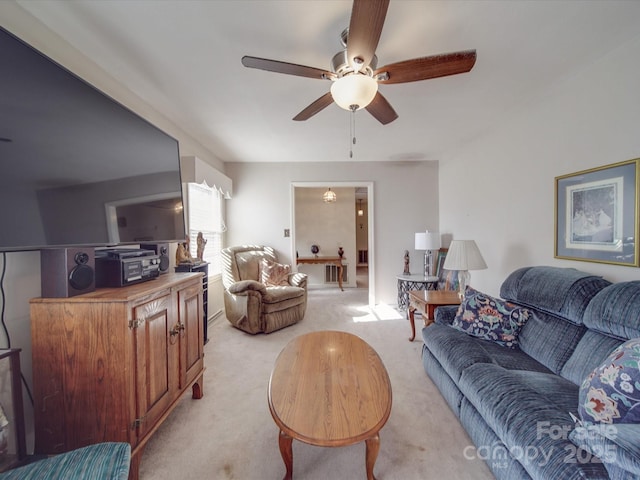 living room featuring ceiling fan and light colored carpet