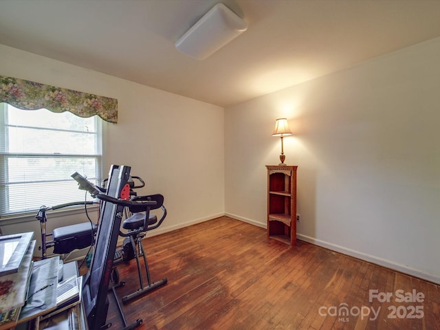 workout area with hardwood / wood-style floors