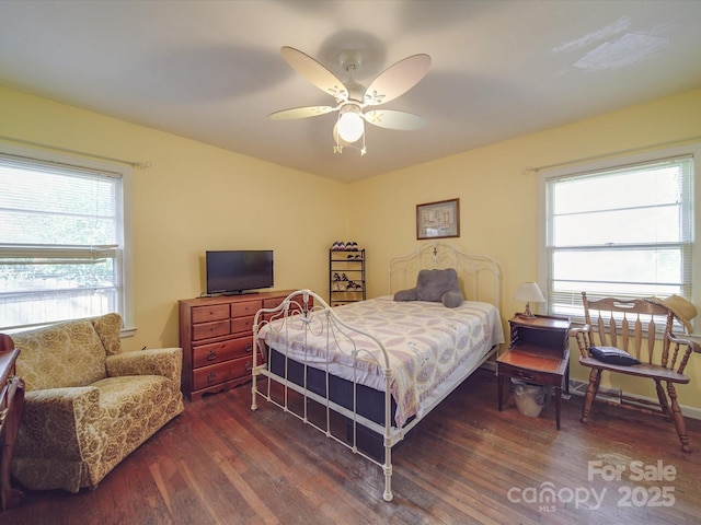 bedroom featuring ceiling fan and dark hardwood / wood-style flooring