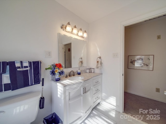 bathroom with vanity and toilet