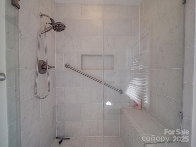 bathroom featuring a tile shower