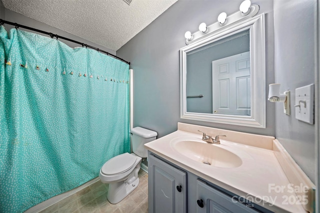 bathroom featuring vanity, curtained shower, toilet, and a textured ceiling