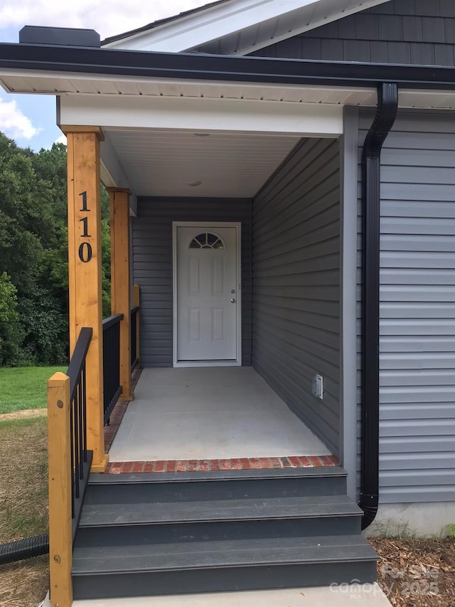 entrance to property with covered porch