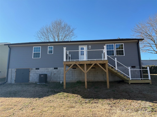 rear view of property with central AC unit and a deck