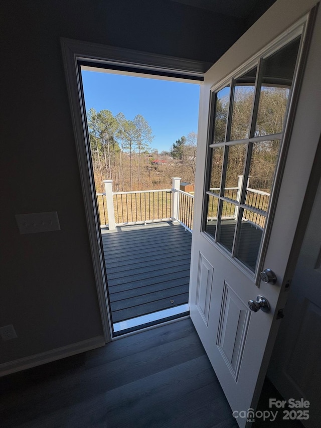 doorway to outside with dark wood-type flooring