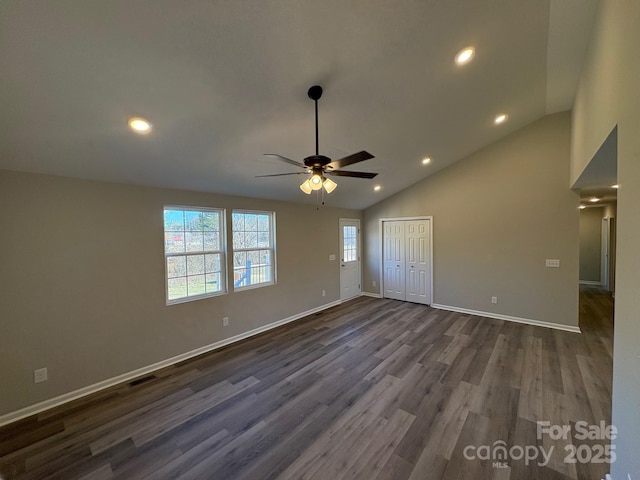 interior space featuring ceiling fan, a closet, dark wood-type flooring, and lofted ceiling