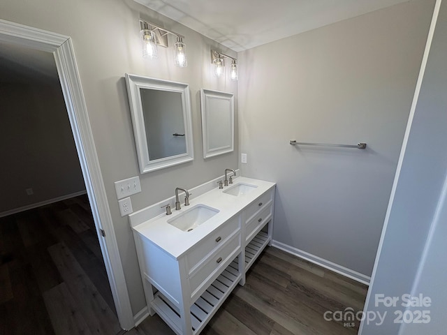 bathroom with hardwood / wood-style floors and vanity