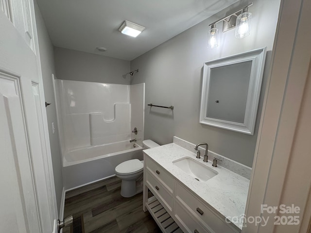 full bathroom featuring vanity, shower / bathtub combination, toilet, and wood-type flooring