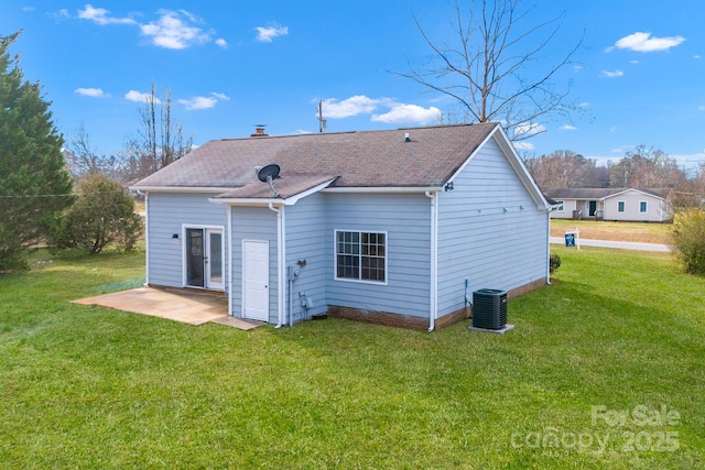 back of property with cooling unit, a lawn, and a patio