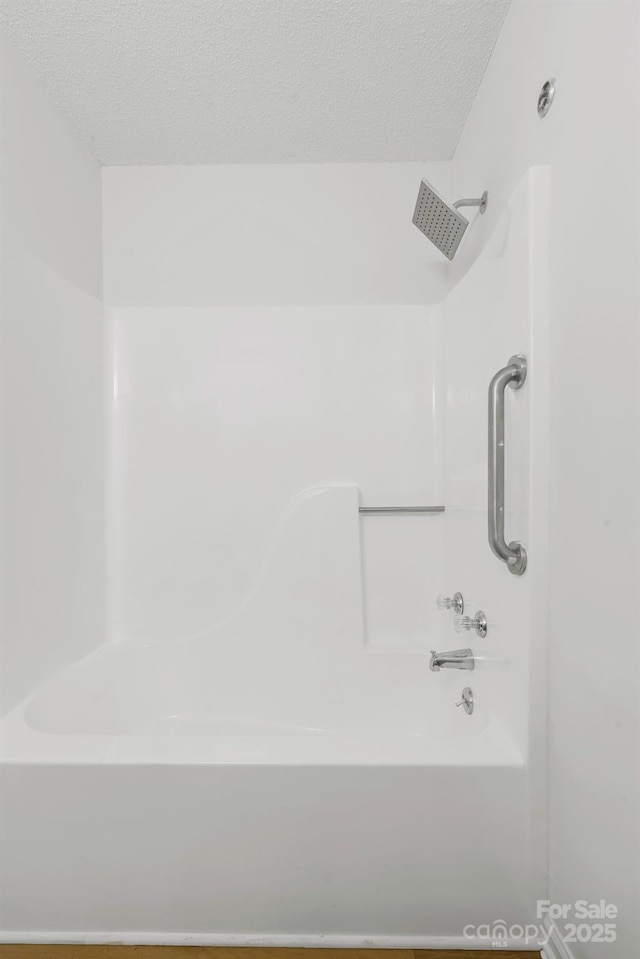 bathroom with a textured ceiling