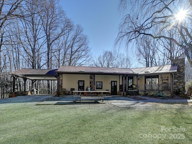 back of house featuring covered porch