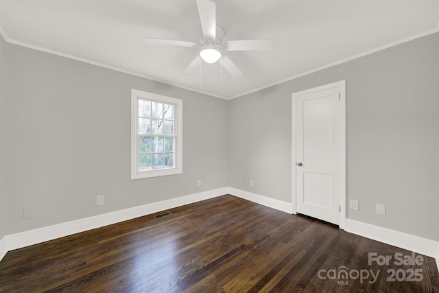 unfurnished room featuring dark hardwood / wood-style floors, ceiling fan, and ornamental molding