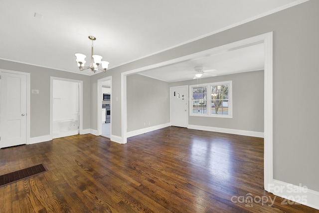 interior space featuring dark hardwood / wood-style floors, ceiling fan with notable chandelier, and ornamental molding