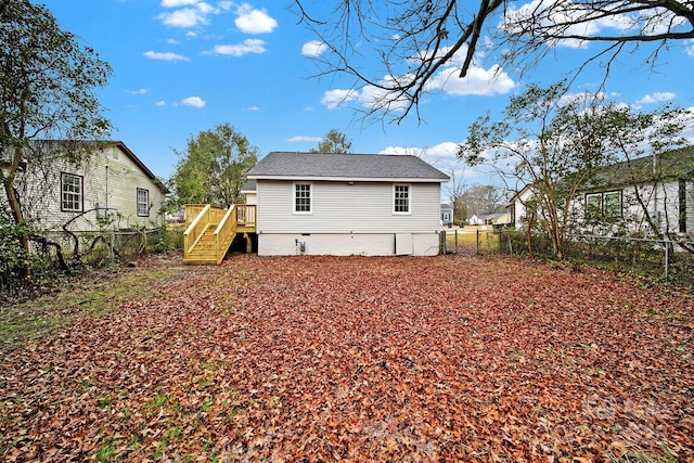 back of house with a wooden deck