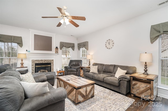 living room featuring hardwood / wood-style flooring, plenty of natural light, and ceiling fan