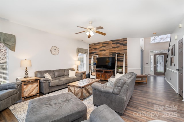 living room with dark hardwood / wood-style floors and ceiling fan