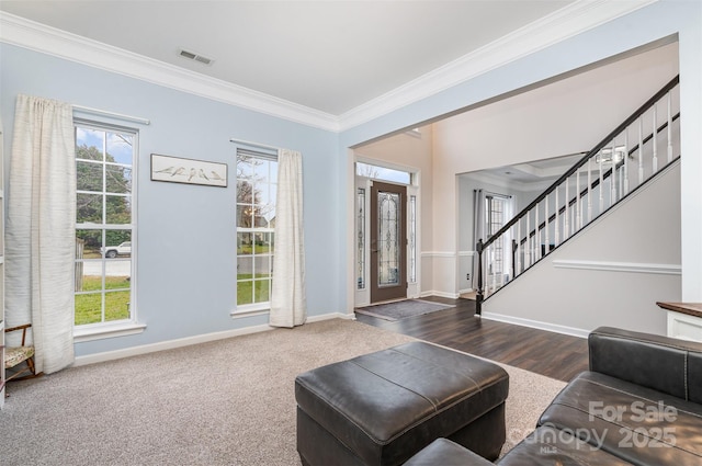 living room featuring dark carpet and ornamental molding