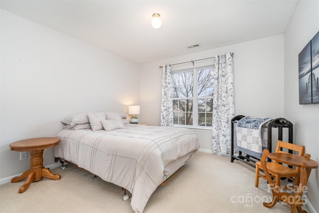 bedroom featuring light colored carpet