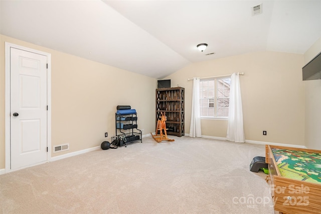 misc room with lofted ceiling and carpet floors